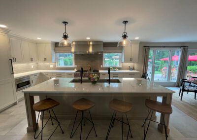 Wood grain melamine Kitchen Island, Compac Unique Countertop, Stainless Steel Range hood, Stainless Steel Wolf Range